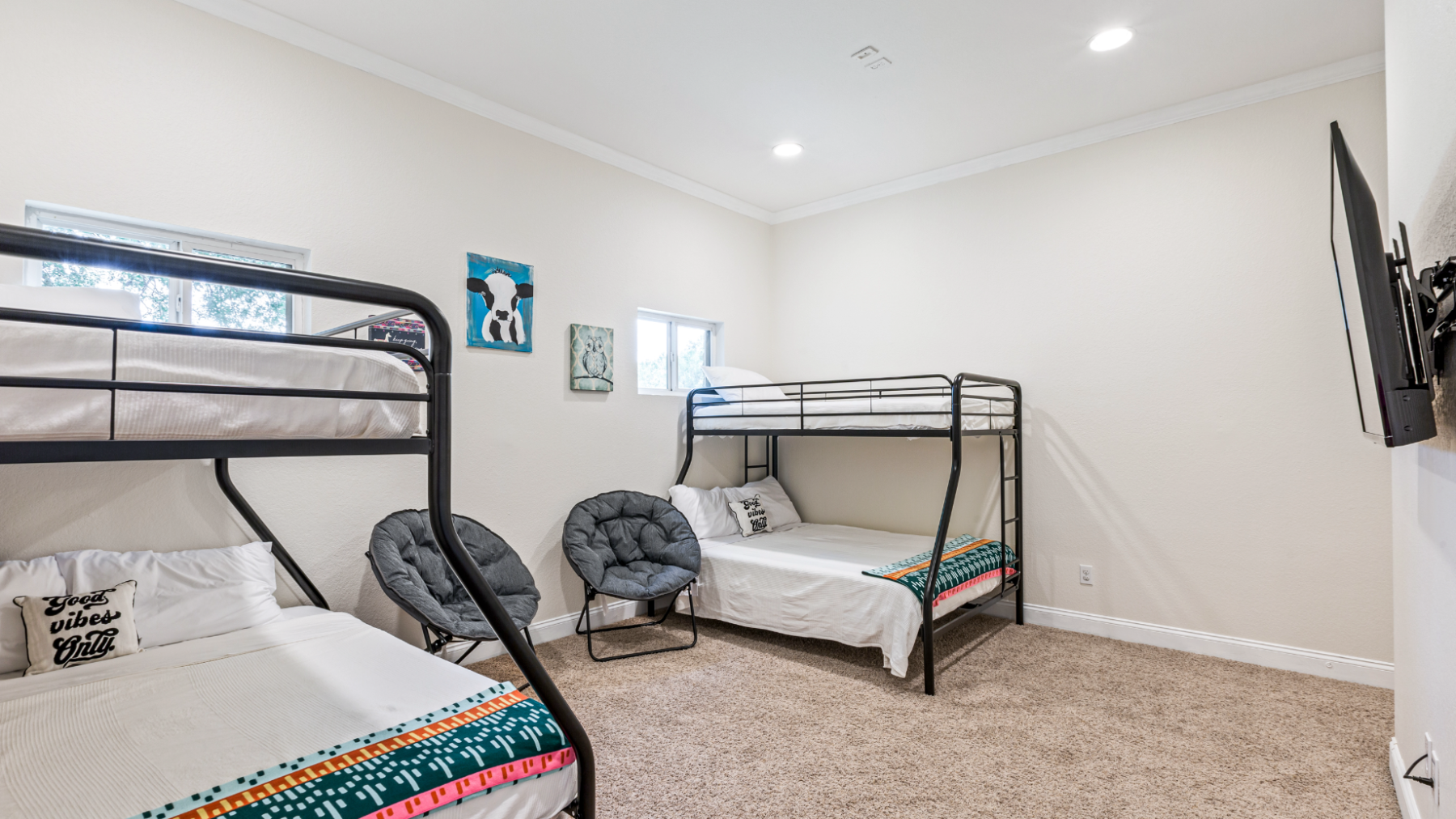 a bedroom with a bed and desk in a room